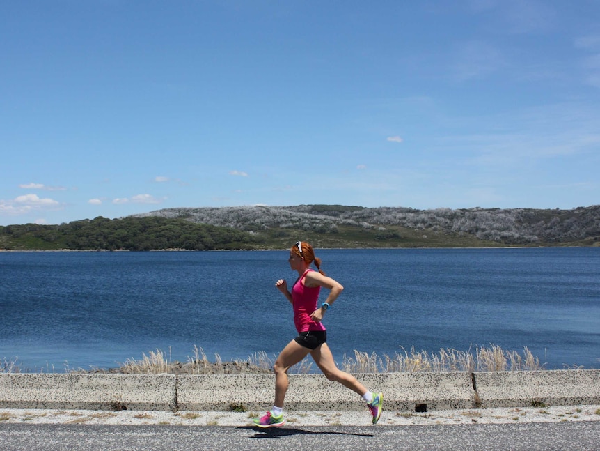 Triathlete Charlotte McShane runs along the road in Gippsland as she trains for the 2016 Olympic Games in Rio de Janeiro.