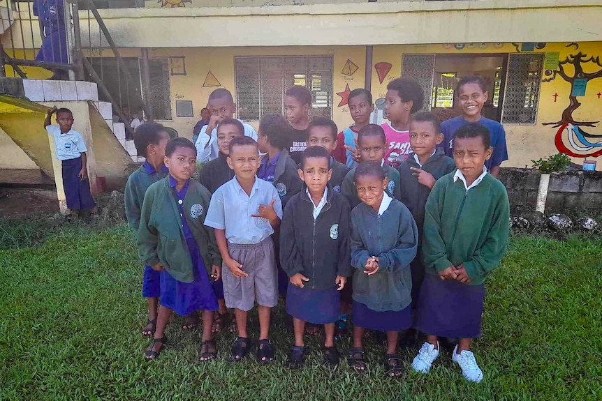 A group of Fijian students wearing Belair Public School uniforms 