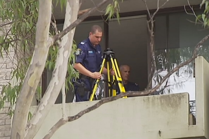 Police inspect balcony at Macquarie Park where a man had a fatal fall