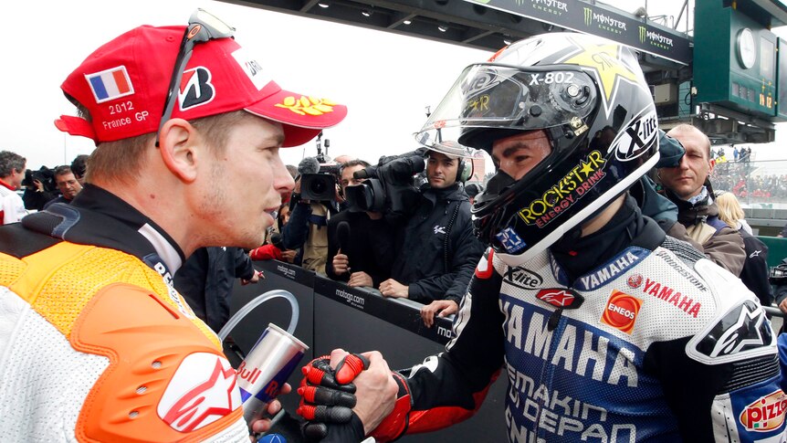 Casey Stoner (L) came third in the French MotoGP behind Jorge Lorenzo.