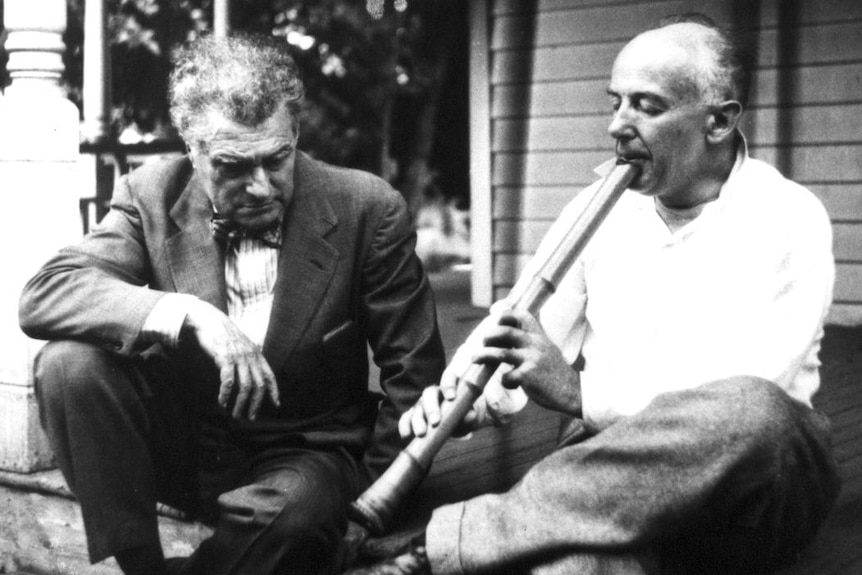Henry Cowell playing the shakuhachi with Edgar Varese