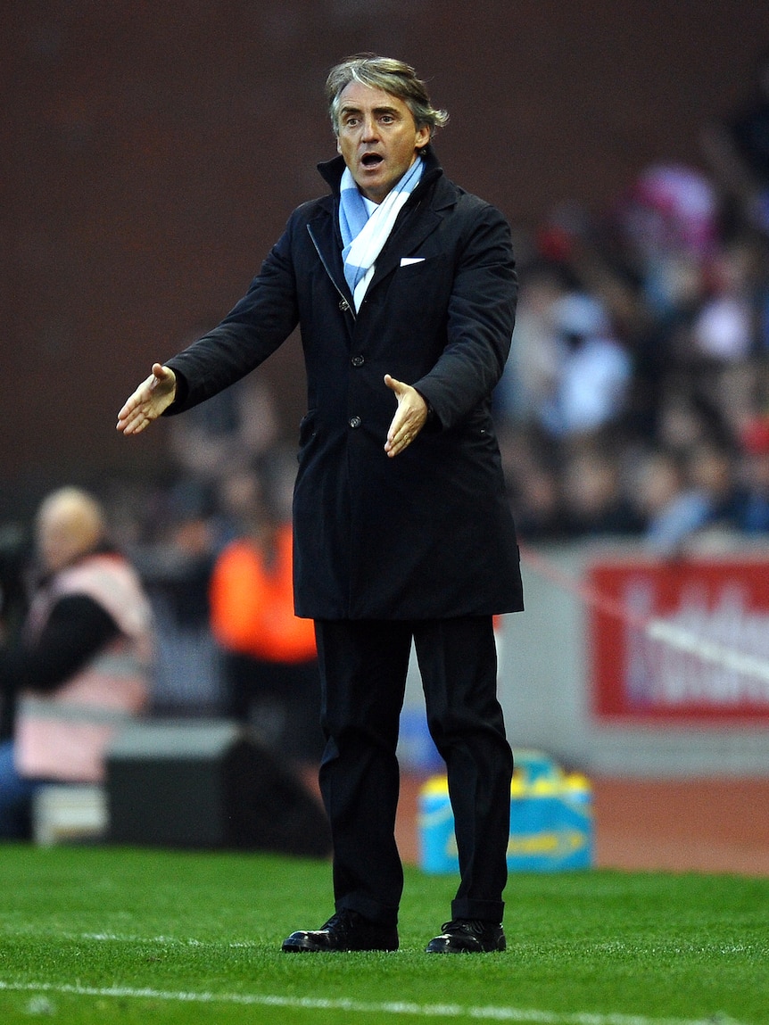 Not impressed ... Manchester City manager Roberto Mancini gestures during the match against Stoke City