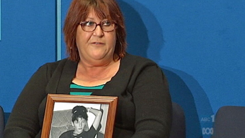 Jenny Bird holds a photo of her daughter Prudence, who has been missing for 19 years.