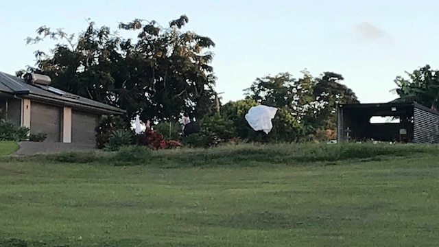 A parachute in a tree on the property where three skydivers died in Mission Beach.
