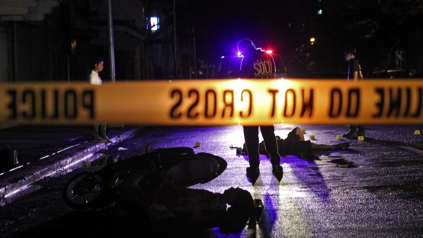 Two suspects lie dead on the street of Adriatico, Manila after failing to stop at a police checkpoint.