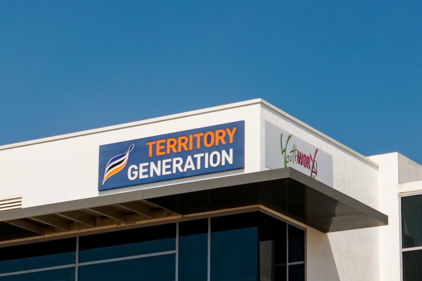 'Territory Generation' sign on a building against a blue sky.