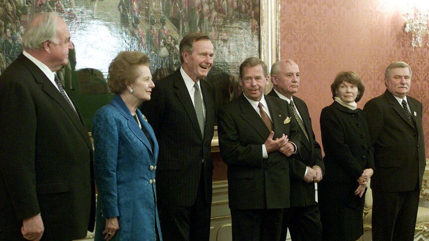 Former leaders from the late 1980s pose at Prague Castle on the 10th anniversary of the Velvet Revolution of 1989.