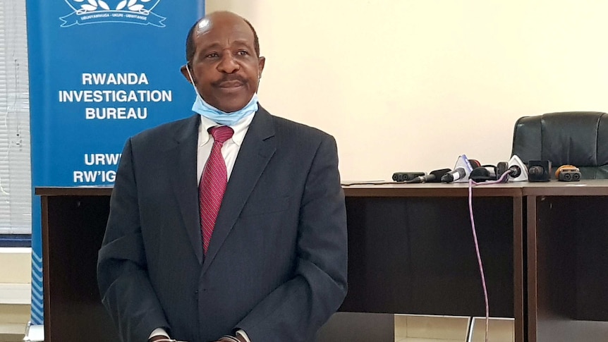 Paul Rusesabagina is paraded in front of media in handcuffs at the headquarters of Rwanda Investigation Bureau.