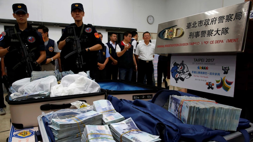 Taiwanese banknotes found in hotel of suspect in ATM heist