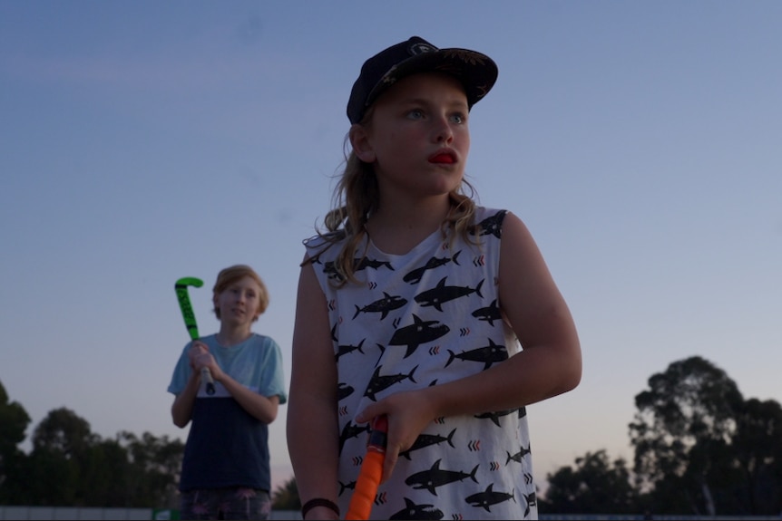 A young player waits for the ball during a hockey training in St Arnaud, Victoria.