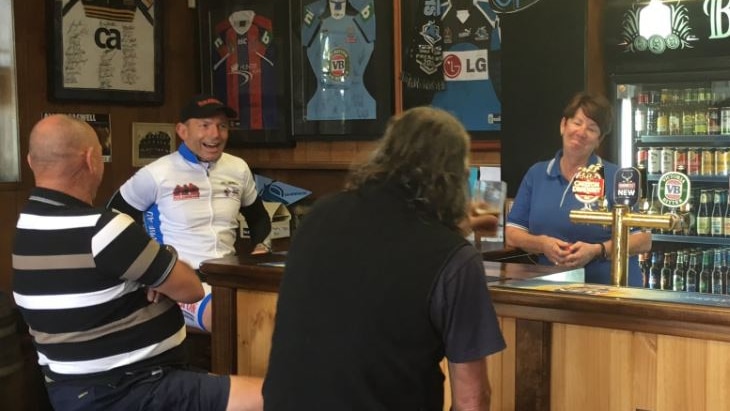 Tony Abbott speaks to locals in the Loaded Dog Hotel pub in Tarago, NSW.