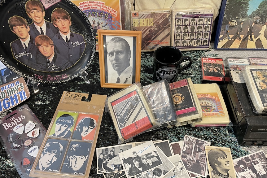 Beatles memorabilia displayed on a table.