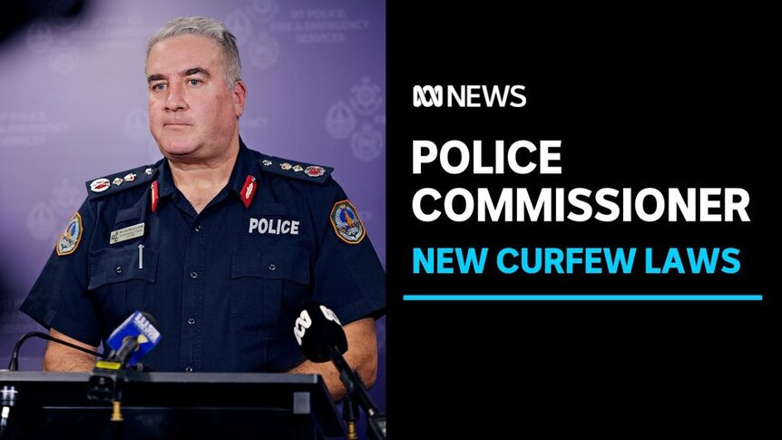 Police Commissioner. New Curfew Laws. Police man standing at a podium with microphones