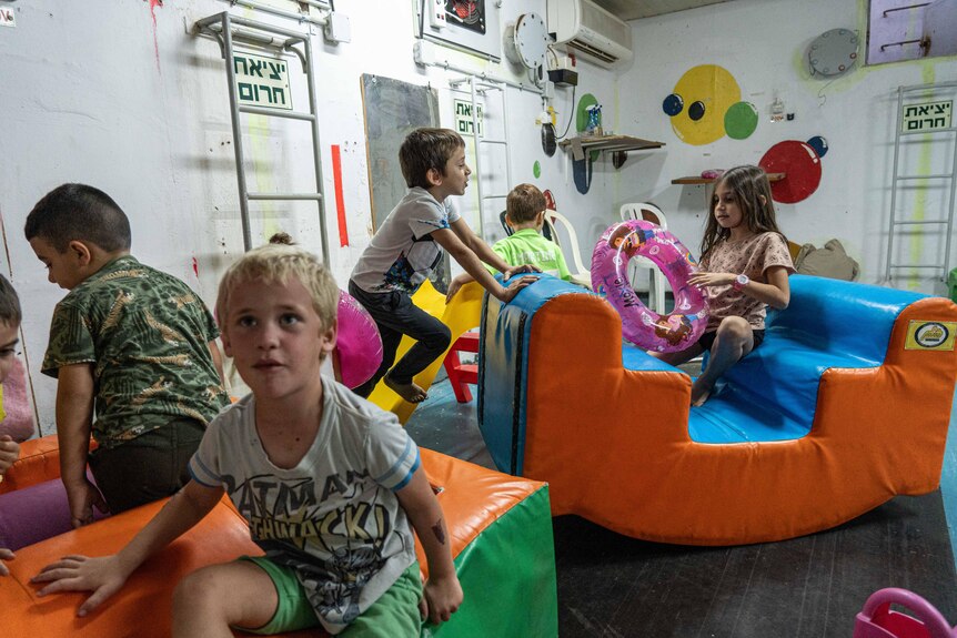A group of children play on equipment inside a bomb shelter in northern Israel.