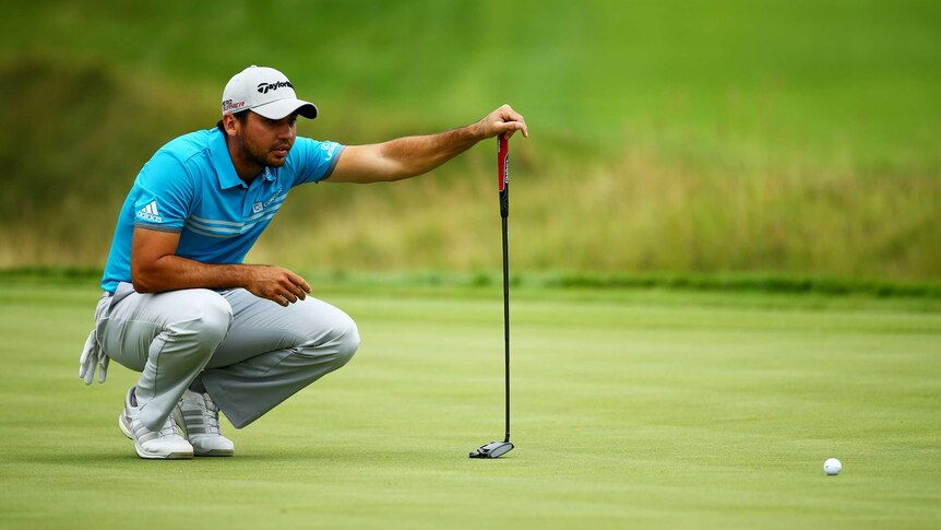 Solid start ... Jason Day lines up a putt on the 18th hole at Whistling Straits