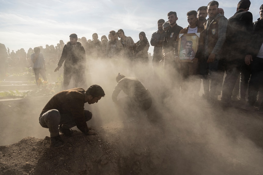 Syrian Kurds attend a funeral.