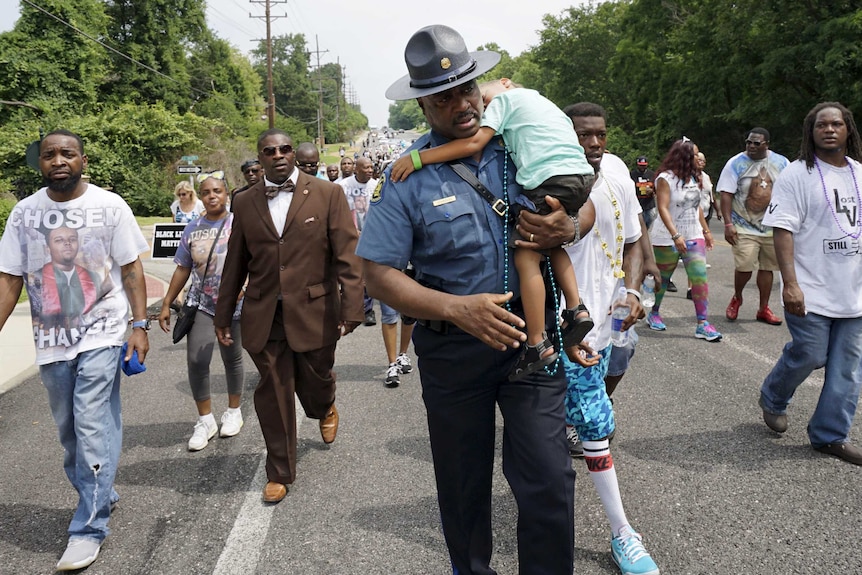 Ferguson police focus on improving relations with black community after fatal shooting