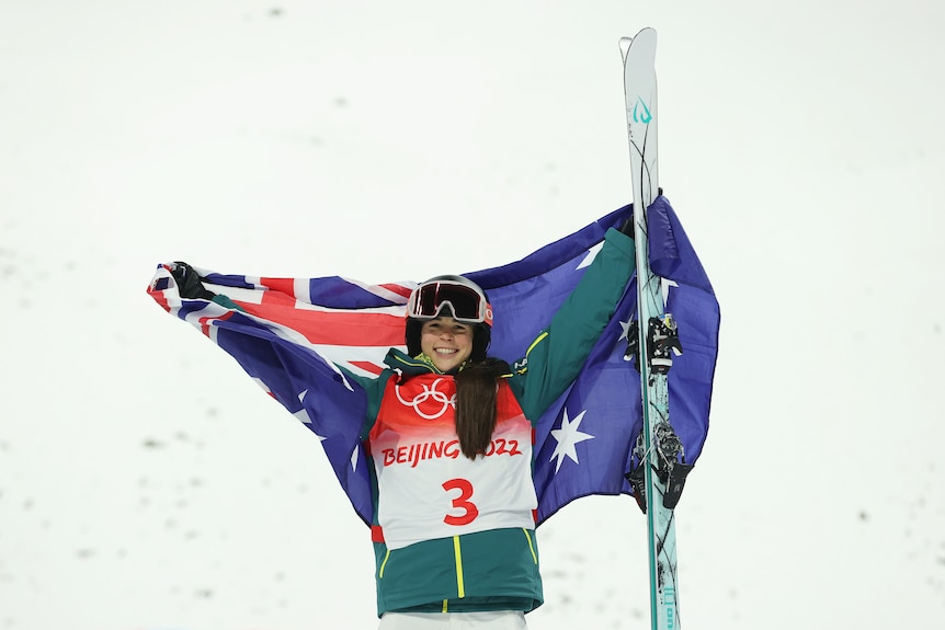 Australia's Jakara Anthony beams as she poses with an Australian flag after winning a gold medal,