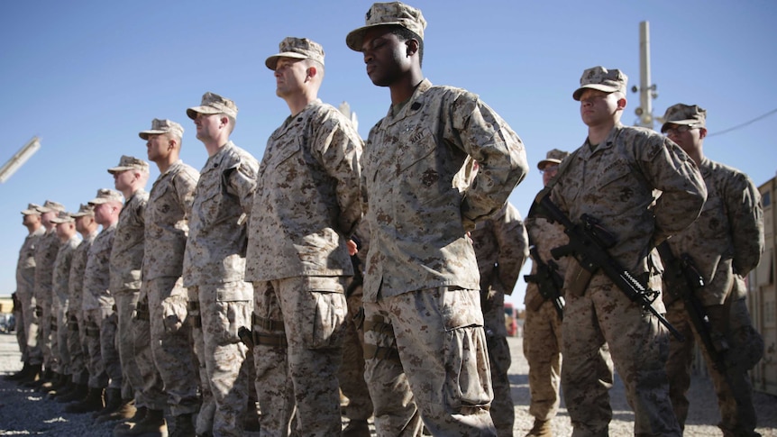 US Marines stand guard during the change of command ceremony at Task Force Southwest military field in Aghanistan