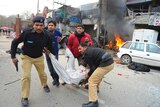 Policemen near explosion site in Lahore, Pakistan