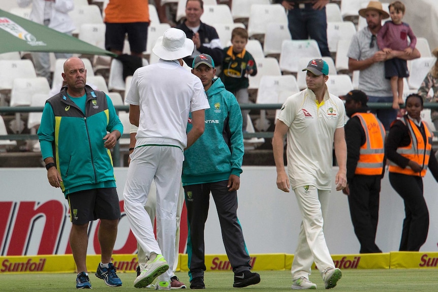 Darren Lehmann and Steve Smith on the field congratulating Morne Morkel.