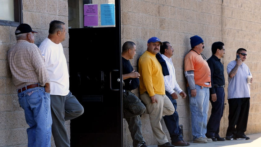 Men wait outside their local union hall after placing their names on the job list in San Marcos, California, November 7, 2008.