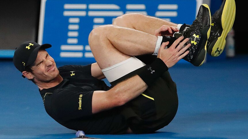 Britain's Andy Murray reacts as he falls in his Australian Open match against Andrey Rublev.