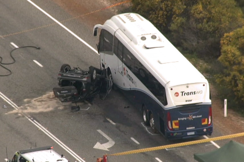 An aerial image of a car lying on its roof next to a bus after a crash on Indian Ocean Drive.