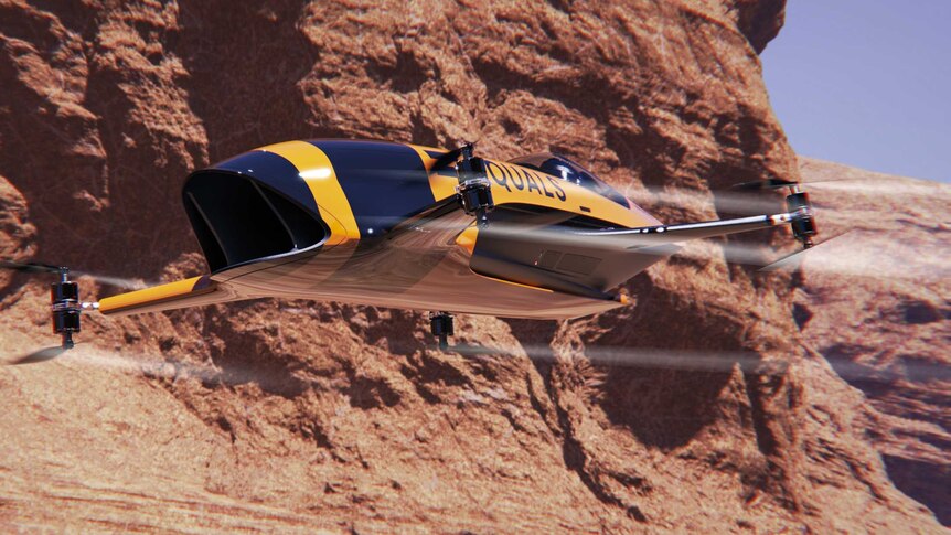 A racing car with four drones instead of wheels flies past a large rocky cliff.