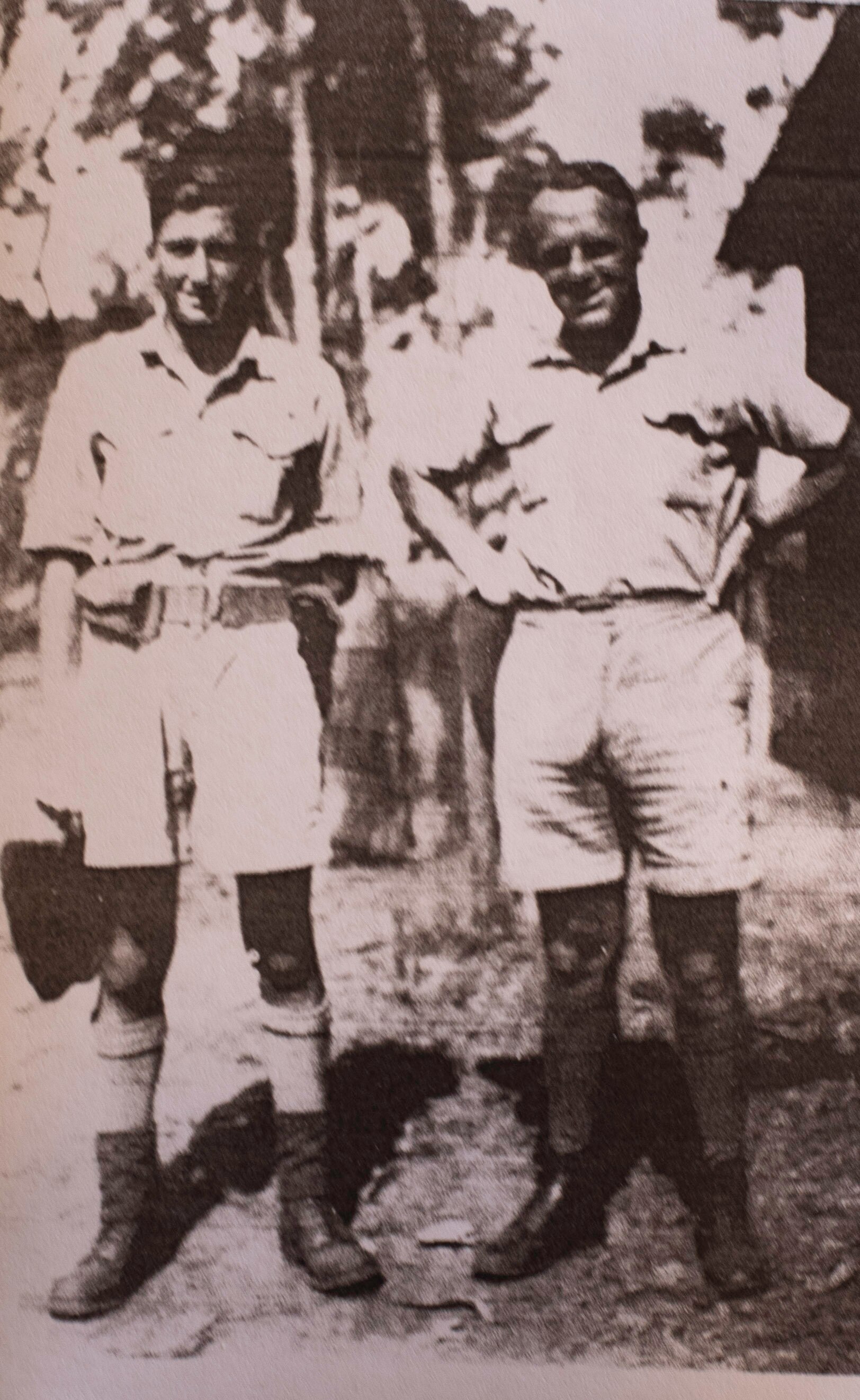 an old photo of two men in military uniform