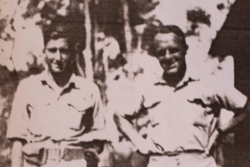 an old photo of two men in military uniform