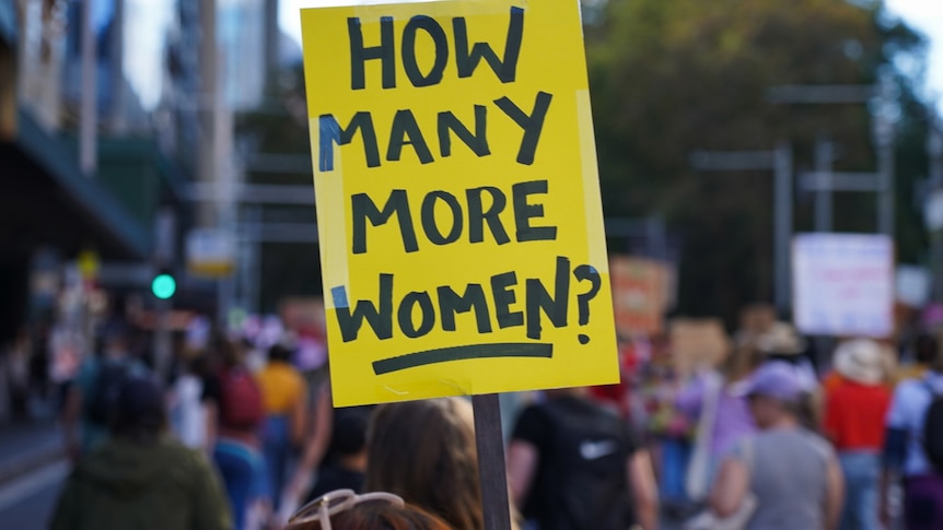 a close up photo of a sign that says how many more women