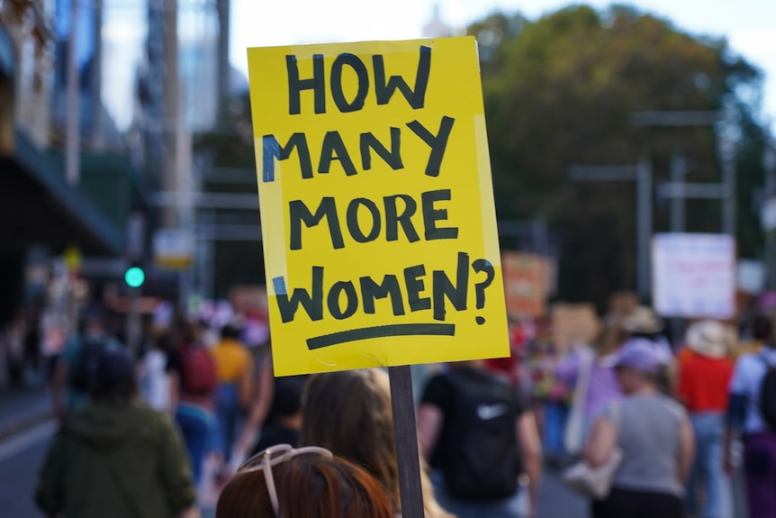a close up photo of a sign that says how many more women