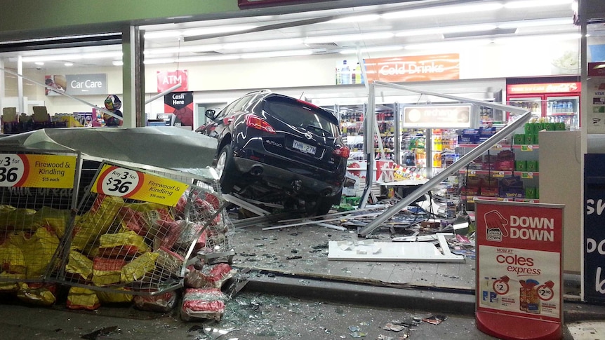 A car with ACT plates crashes into Shell service station.