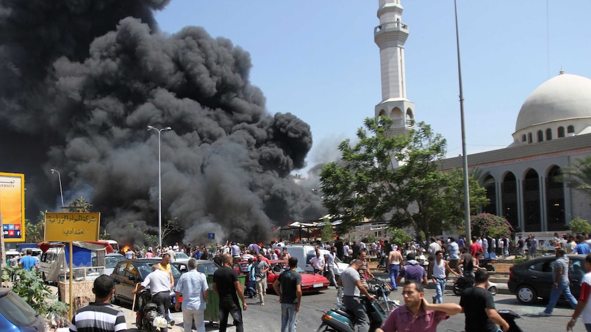 Smoke rises from outside a mosque.