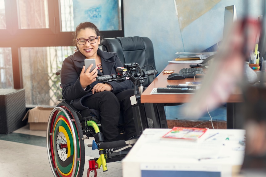 Woman in a wheelchair with brightly coloured wheels
