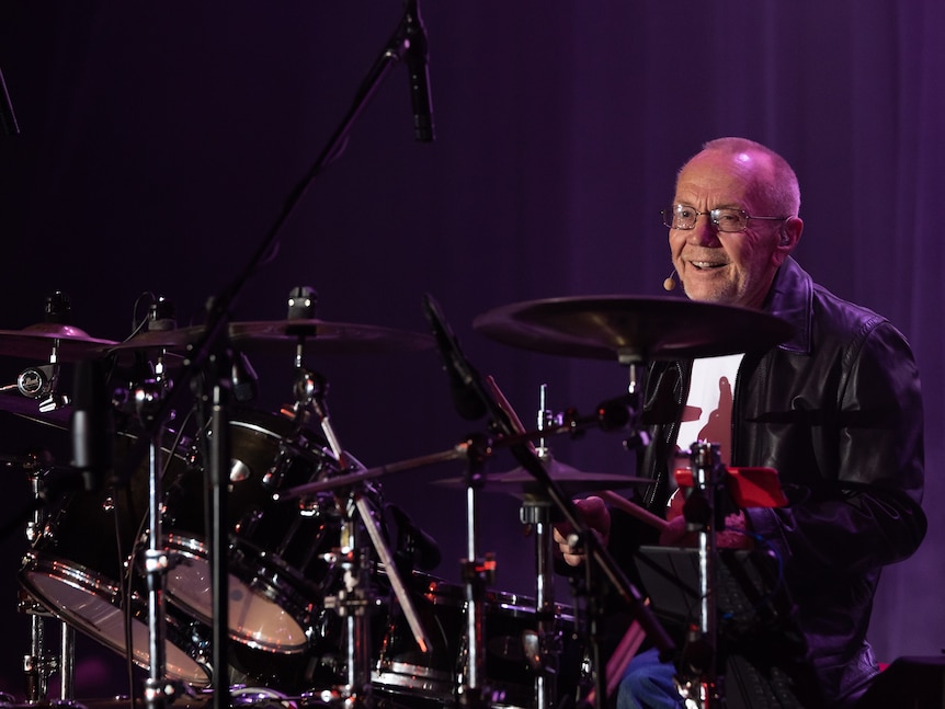 older man on drums 