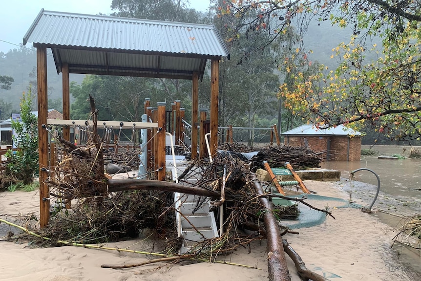 A playground covered in flood debris