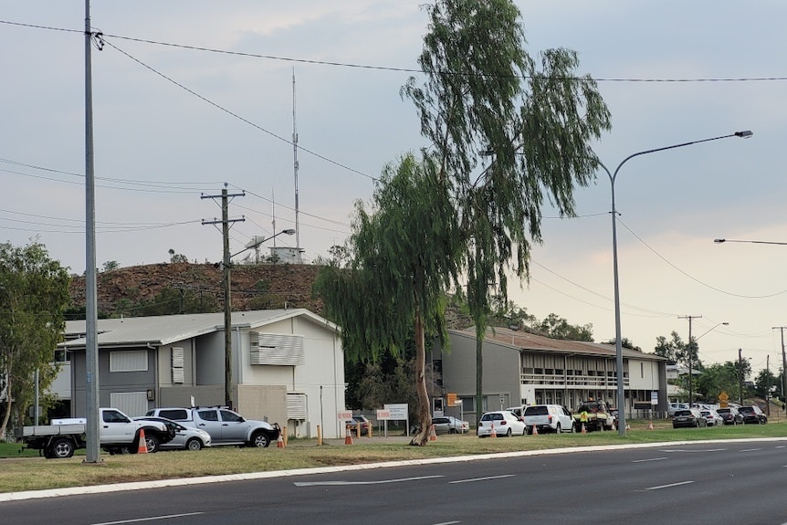 cars lining up to get tested at a covid-19 drive through clinic