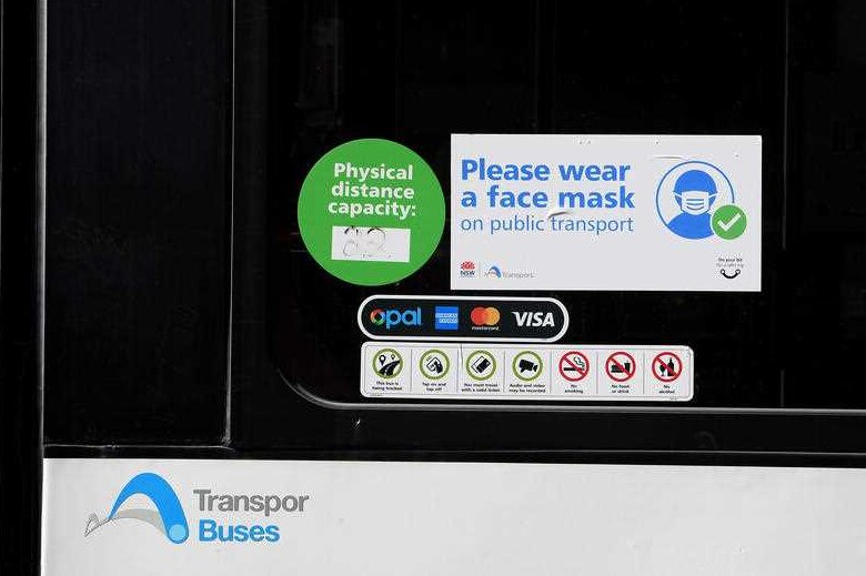 Signs on Sydney buses advising commuters.