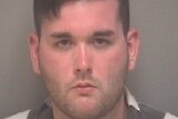 A police mug shot of James Alex Fields Jr in a black and white shirt.
