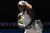 Destanee Aiava plays a double-fisted backhand against Simona Halep in their first-round match of the Australian Open.