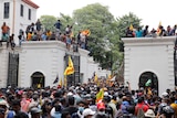 Demonstrators protest outside presidents house
