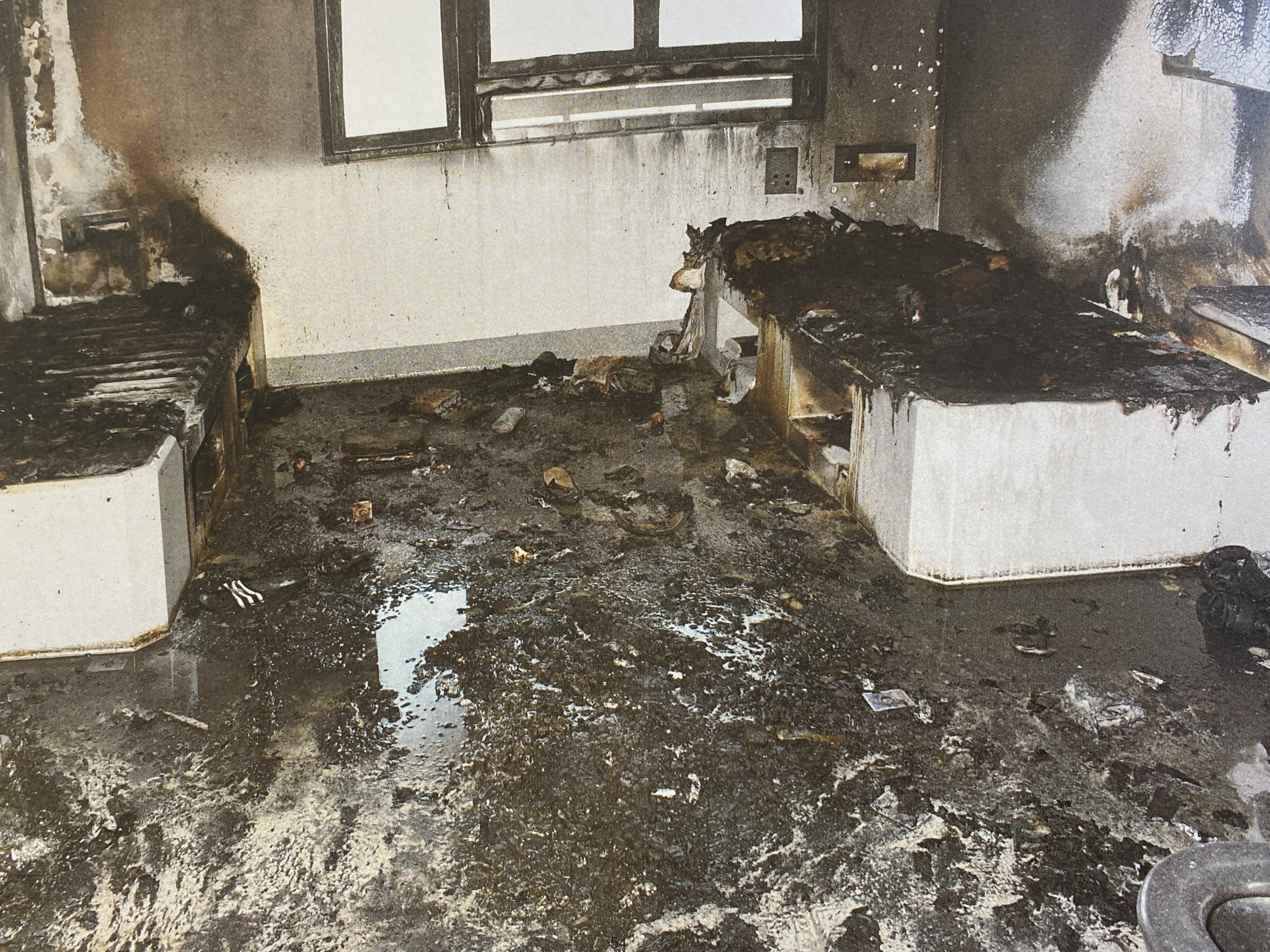 Damage from a fire in a prison cell.