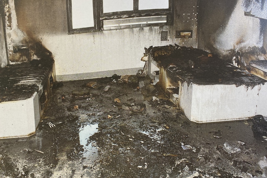 Damage from a fire in a prison cell.