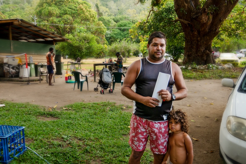 A young man with his child.