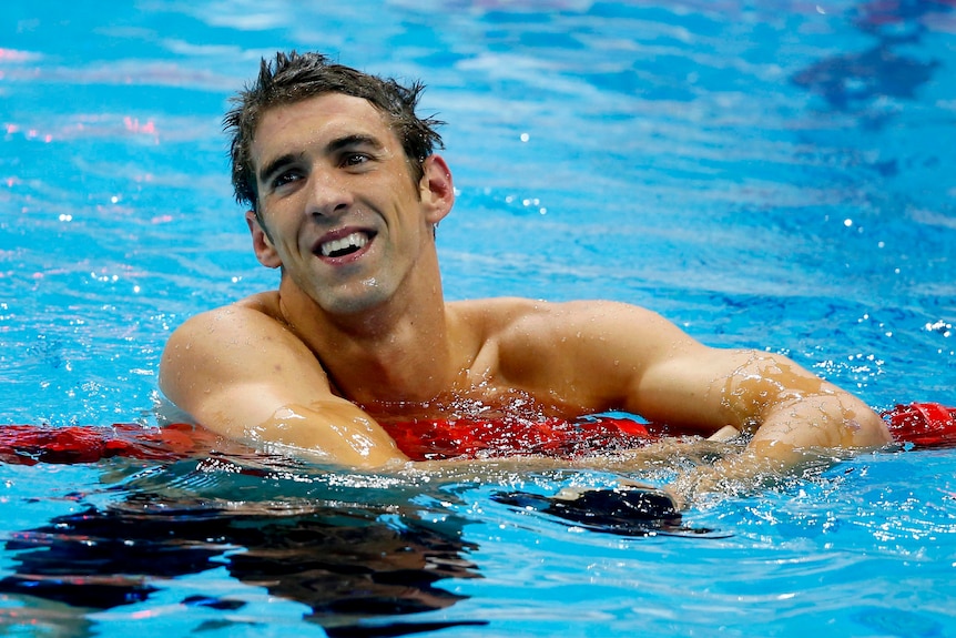 Michael Phelps of the US smiles with relief after winning his 19th Olympic medal.