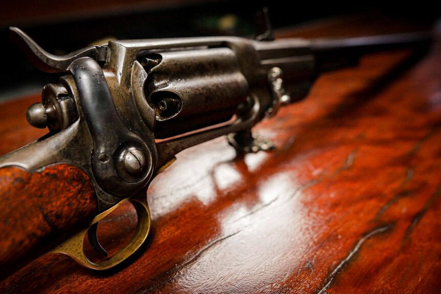 A close up of an old gun.