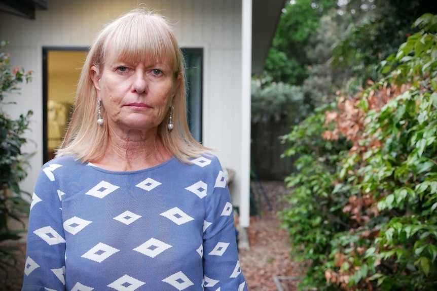 Byron Bay woman Jann Burmester stands outside her home.