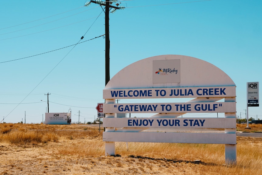 A white welcome sign into the rural town of Julia Creek